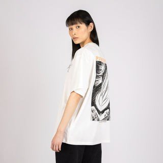 3. Close-up of female model wearing Moomin unisex t-shirt, showing back design and relaxed fit