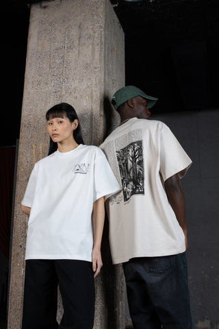 1. Unisex Moomin t-shirt worn by male and female models in urban setting, showcasing front and back design