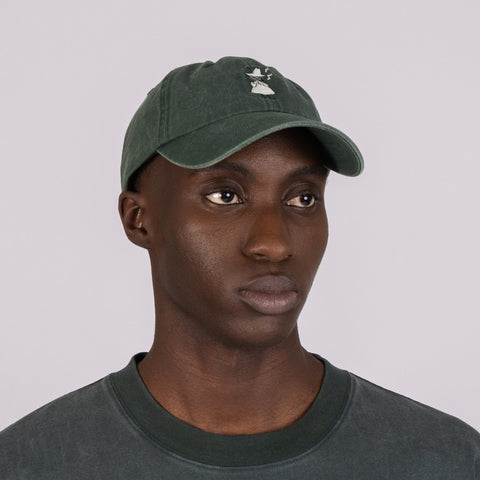 2. Men's green Moomin washed denim cap shown on model in studio, front view