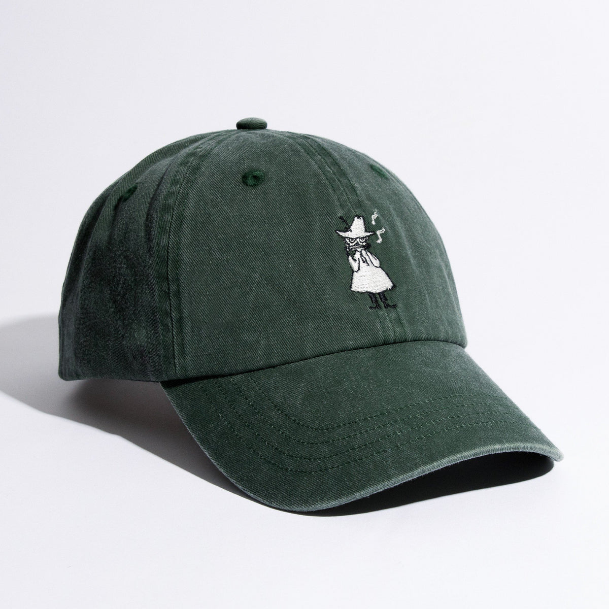 3. Green Moomin washed denim cap in studio, showcasing front embroidery and curved brim
