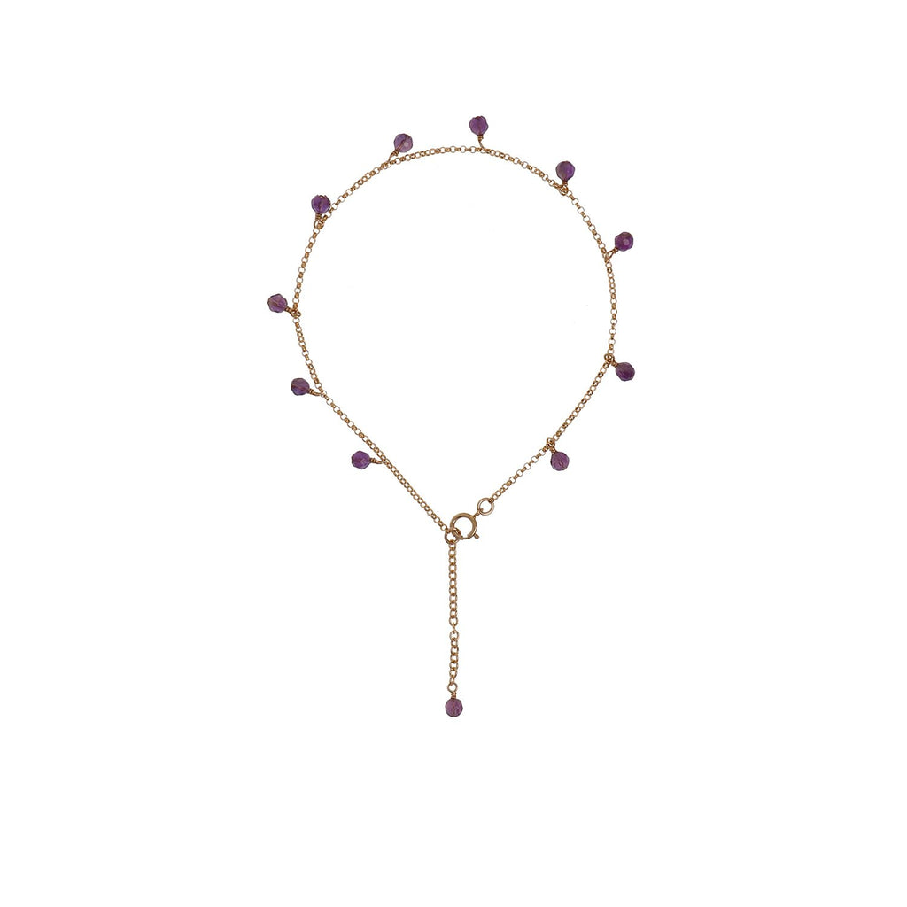 7. Studio image of New Vintage by Kriss Anklet Eat, Pray, Love in gold with amethyst accents