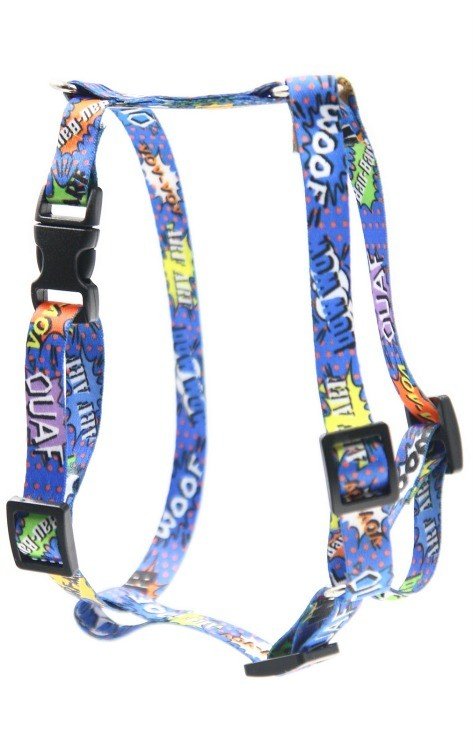 3. Close-up of blue graffiti-patterned nylon harness with black plastic components and colorful text, shown in studio lighting