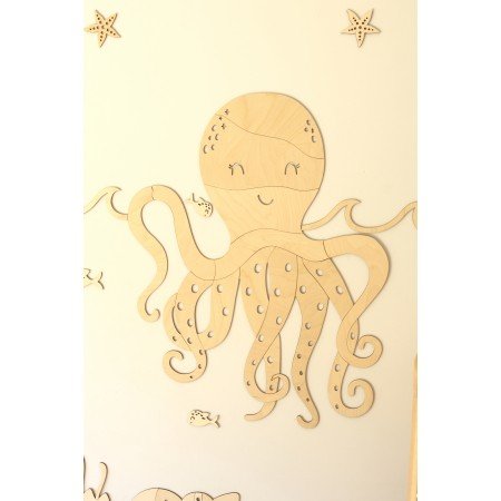 5. Wooden octopus wall decoration with fish and starfish accents, part of an ocean-themed nursery decor