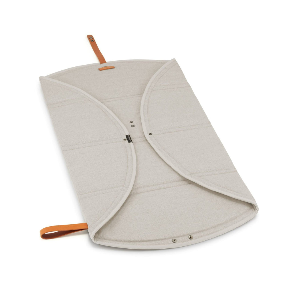 5. Beige Okka travel mat fully opened with brown leather strap on white background