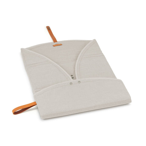 4. Beige Okka travel mat partially opened showing interior design and brown leather strap