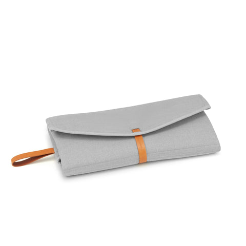 1. Folded grey Okka travel mat with brown leather strap and handle on white background