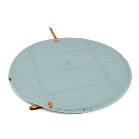 4. Flat lay of Okka travel mat in soft teal with brown leather accents, fully opened