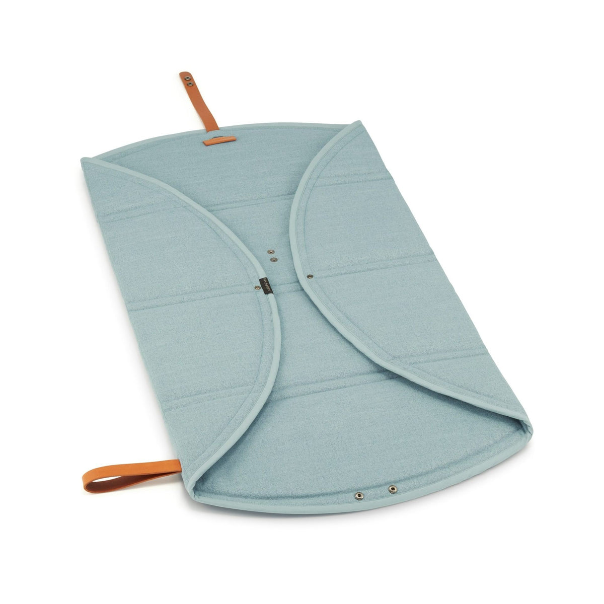 3. Okka travel mat in soft teal partially folded with brown leather strap on white background