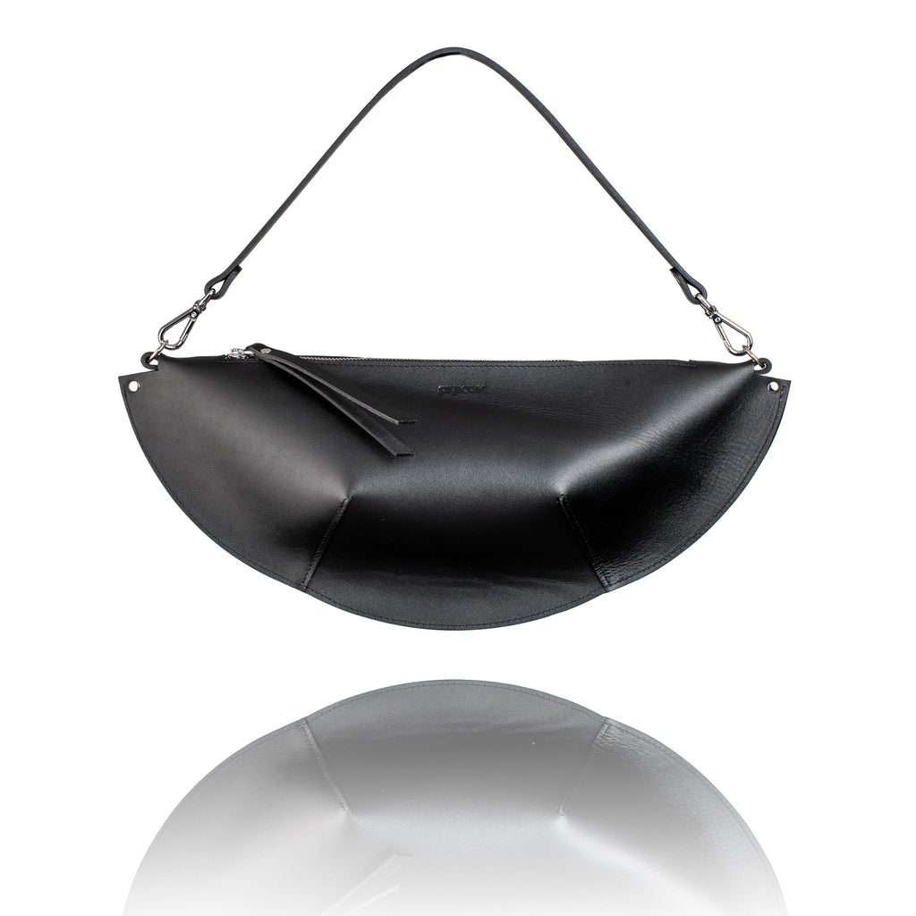 4. Studio shot of PYKOK Olivia black leather handbag with short handle and unique design