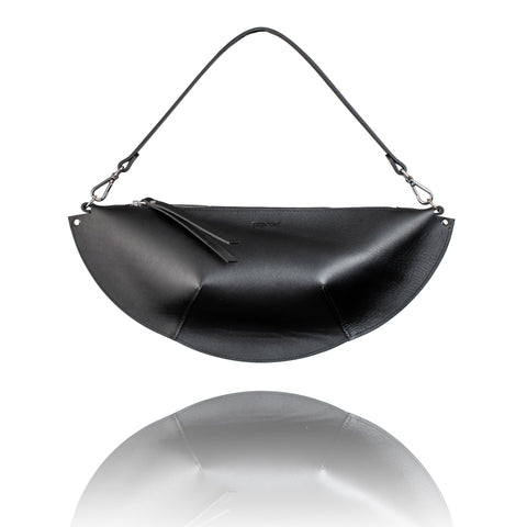 4. Studio shot of PYKOK Olivia black leather handbag with short handle and unique design