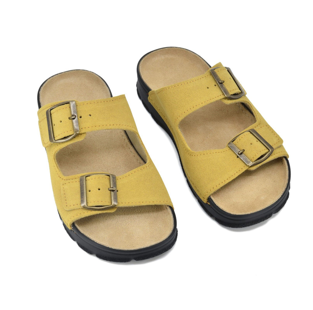 1. Omaking Meeliku Sandals in yellow leather with adjustable buckle straps, shown in studio setting