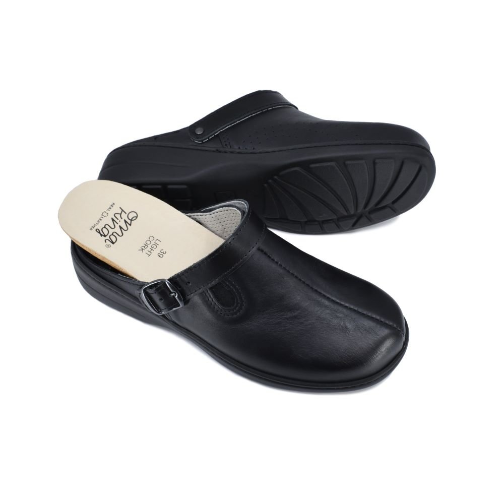 2. Pair of Omaking Loosu black leather sandals with removable cork insole, displayed in studio with view of sole and top