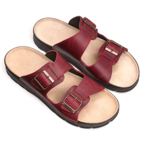 1. Omaking Märt Sandals in bordeaux leather with two adjustable buckle straps, shown in studio setting