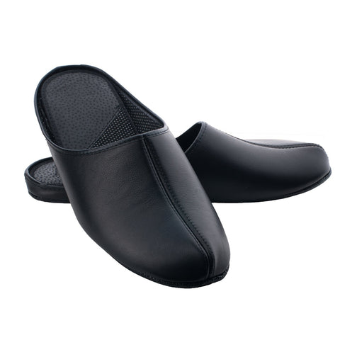 2. Pair of Omaking black leather slippers Sänna shown in studio setting, highlighting smooth leather and textile lining