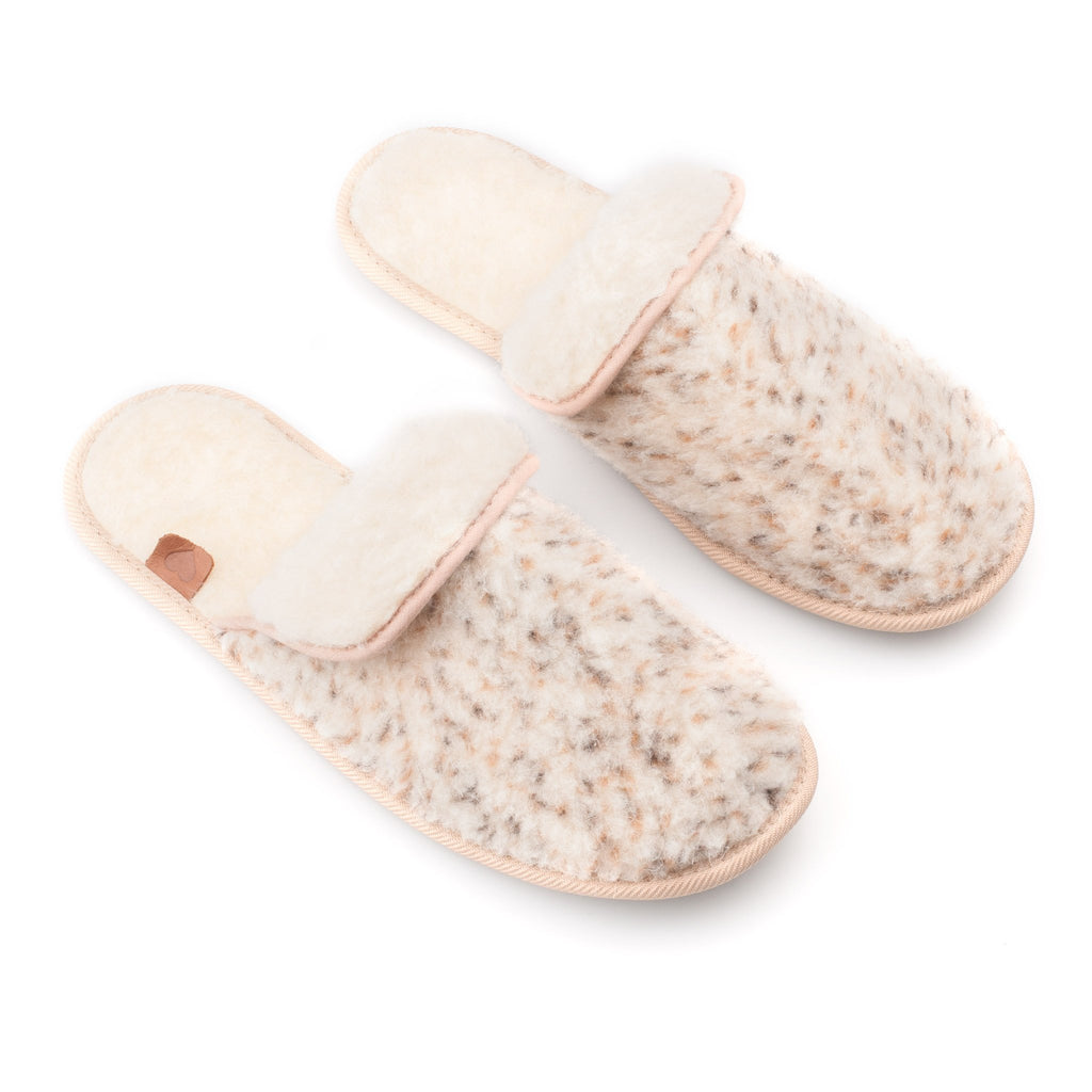 2. Pair of beige lambswool slippers by Omaking, top view highlighting plush material and slip-on design