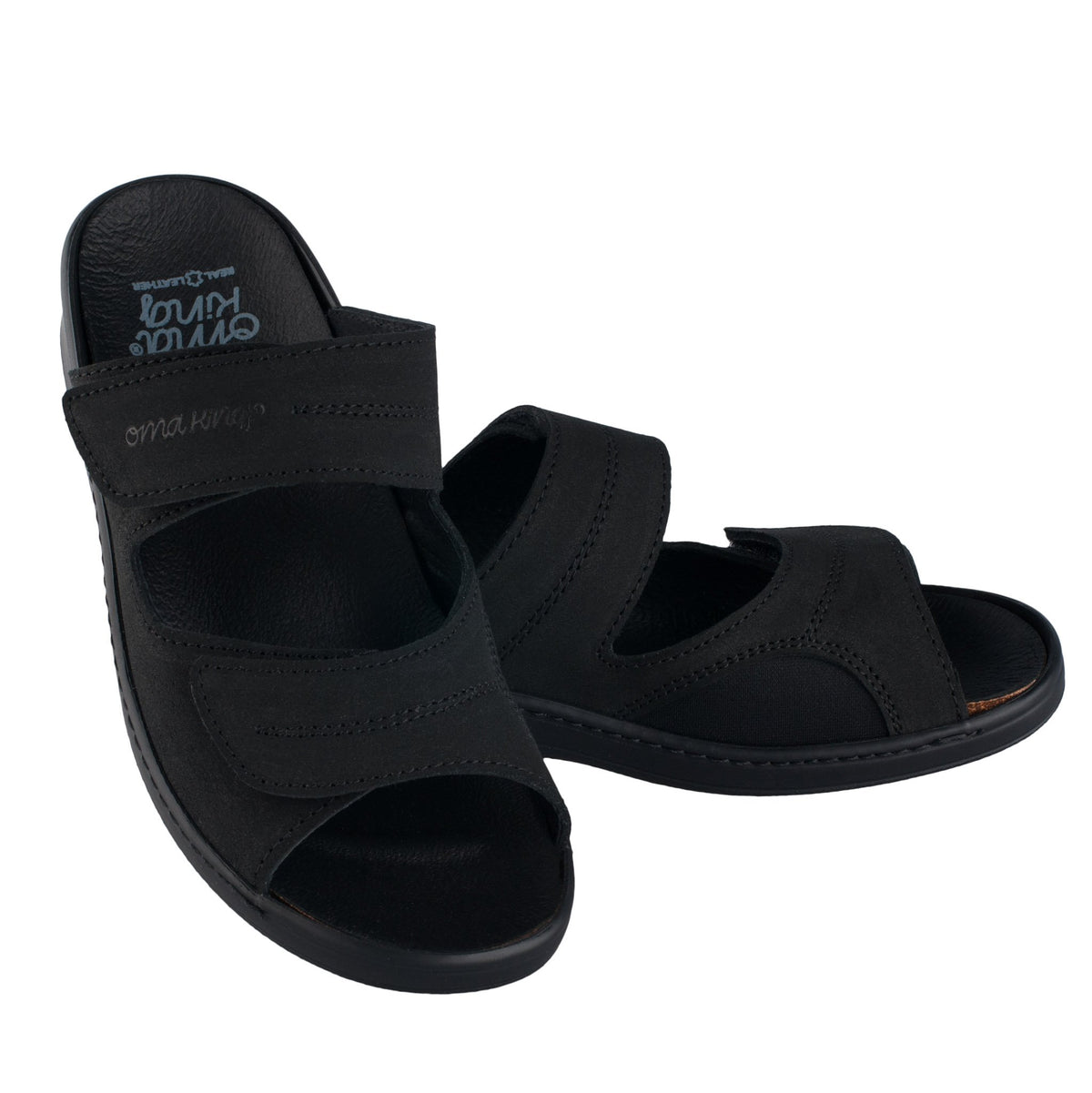 2. Studio image of Omaking black professional heel-cushioned sandals with adjustable Velcro straps and ergonomic latex-cork insole