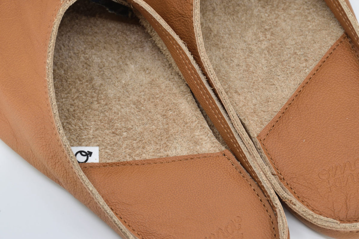 4. Close-up of Omaking Sulbi women's slippers in light brown, showing interior and leather detail