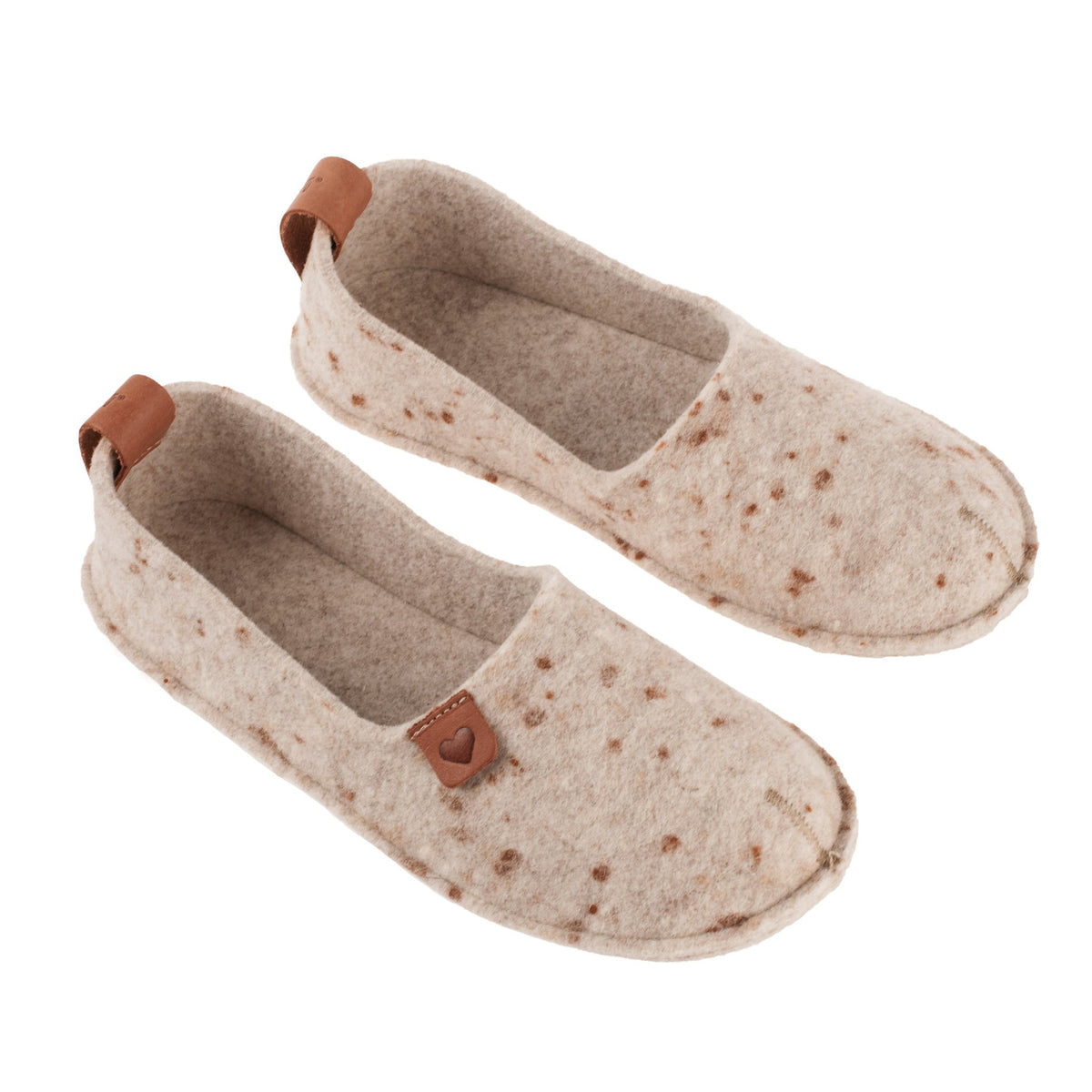 2. Pair of women's beige felt slippers by Omaking with rubber sole, displayed in studio