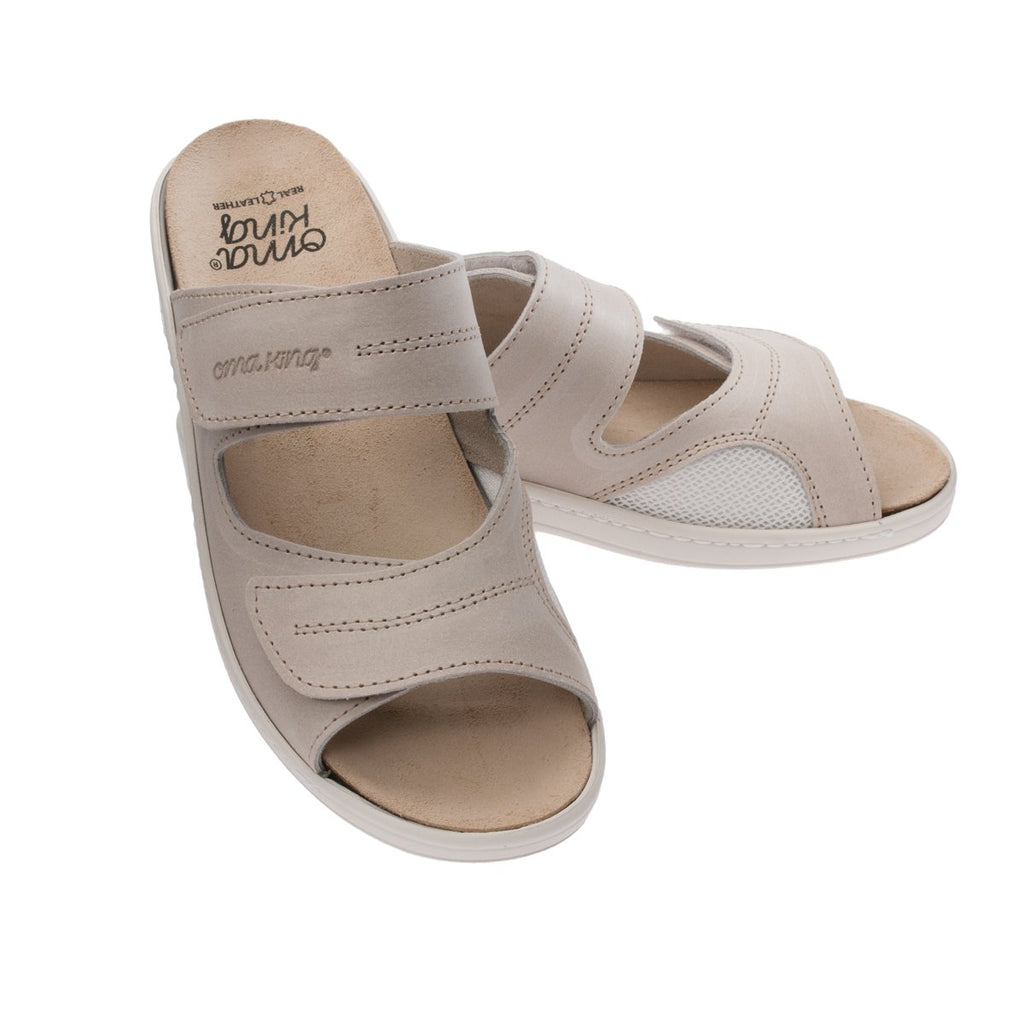 2. Pair of OmaKing beige sandals with ergonomic insole and arch support, displayed in studio
