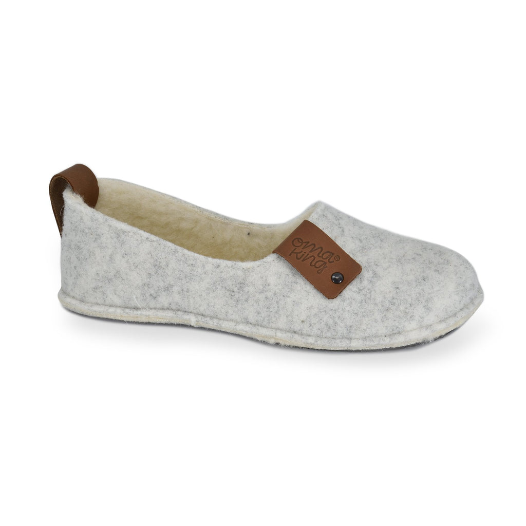 1. Women's white Toku slippers by OmaKing, featuring natural felt upper and lambswool lining, shown in studio