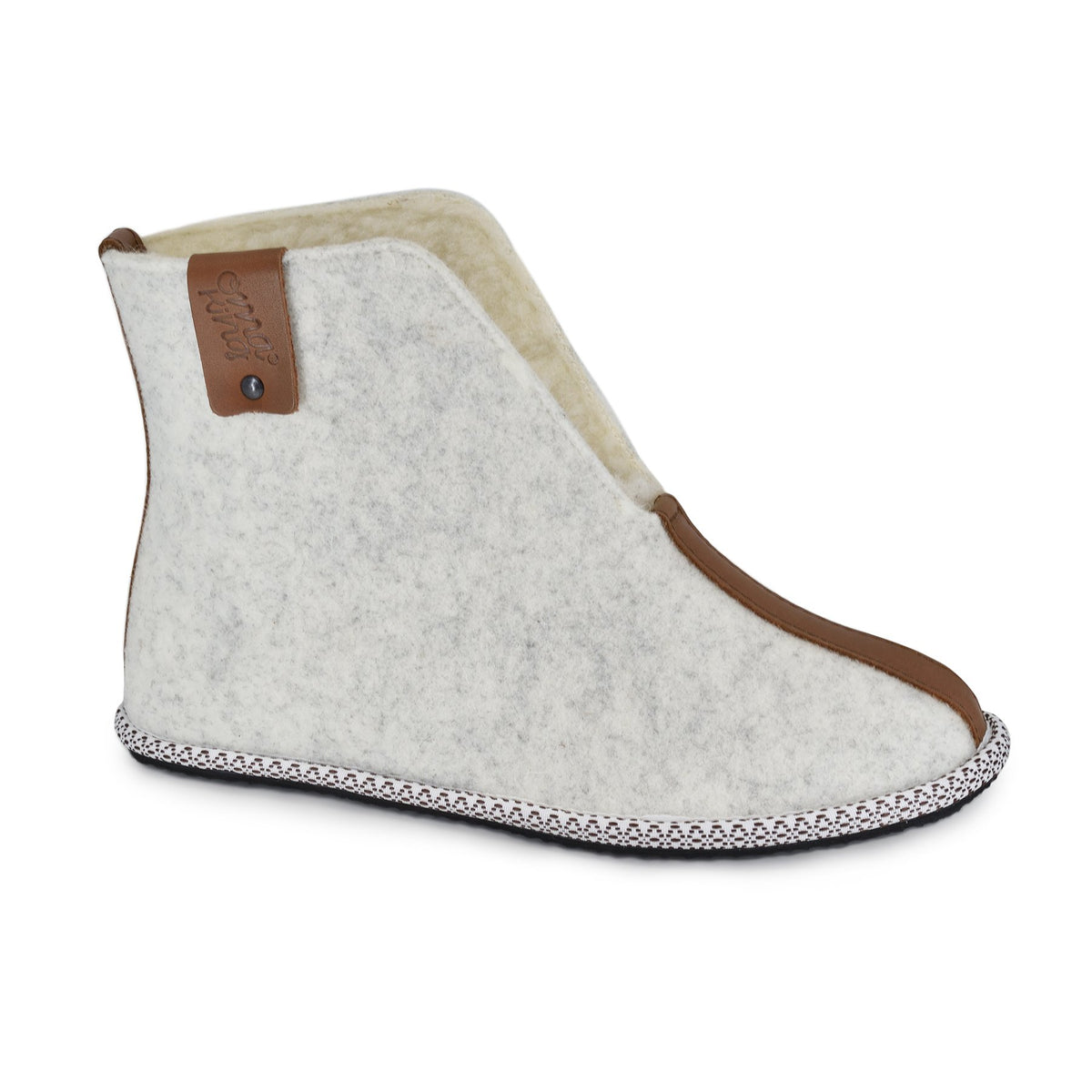 1. Omaking Villa slipper in natural felt with lambswool lining, side view showing brown trim and rubber sole