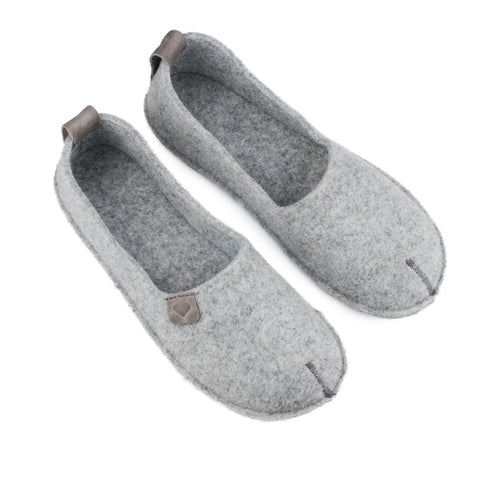 1. Women's grey Toku slippers by OmaKing, featuring natural felt upper and rubber sole, shown in studio setting