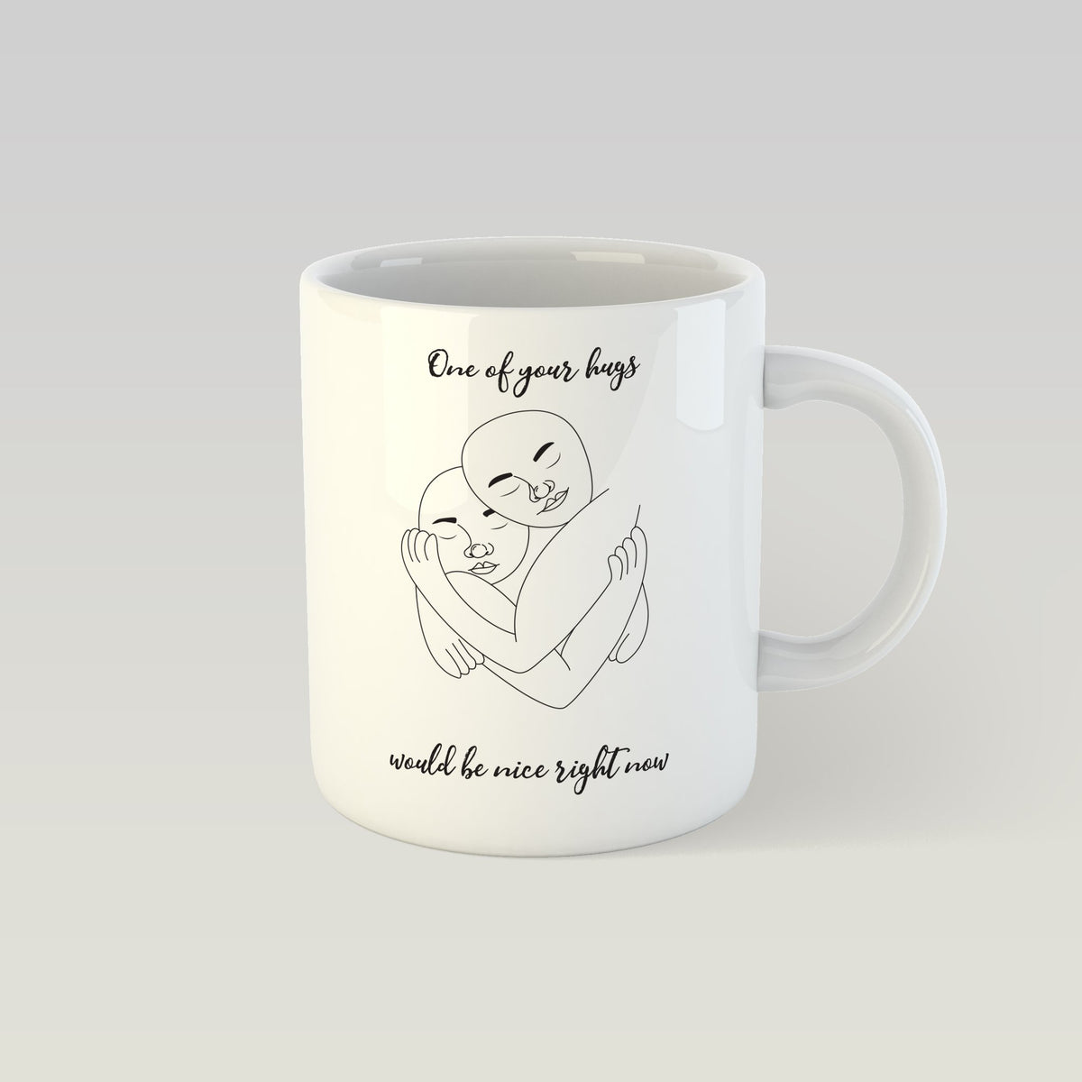 1. SEIK design mug with 'One of your hugs would be nice right now' text and hugging illustration, 330ml capacity, shown in studio setting