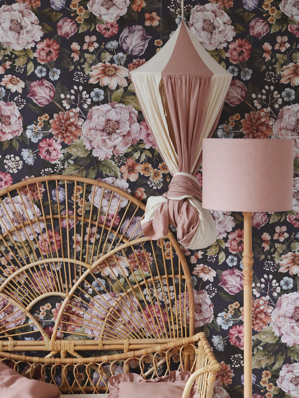 9. Powder pink and cream canopy in a floral-themed room with wicker furniture, enhancing the vintage and cozy decor.