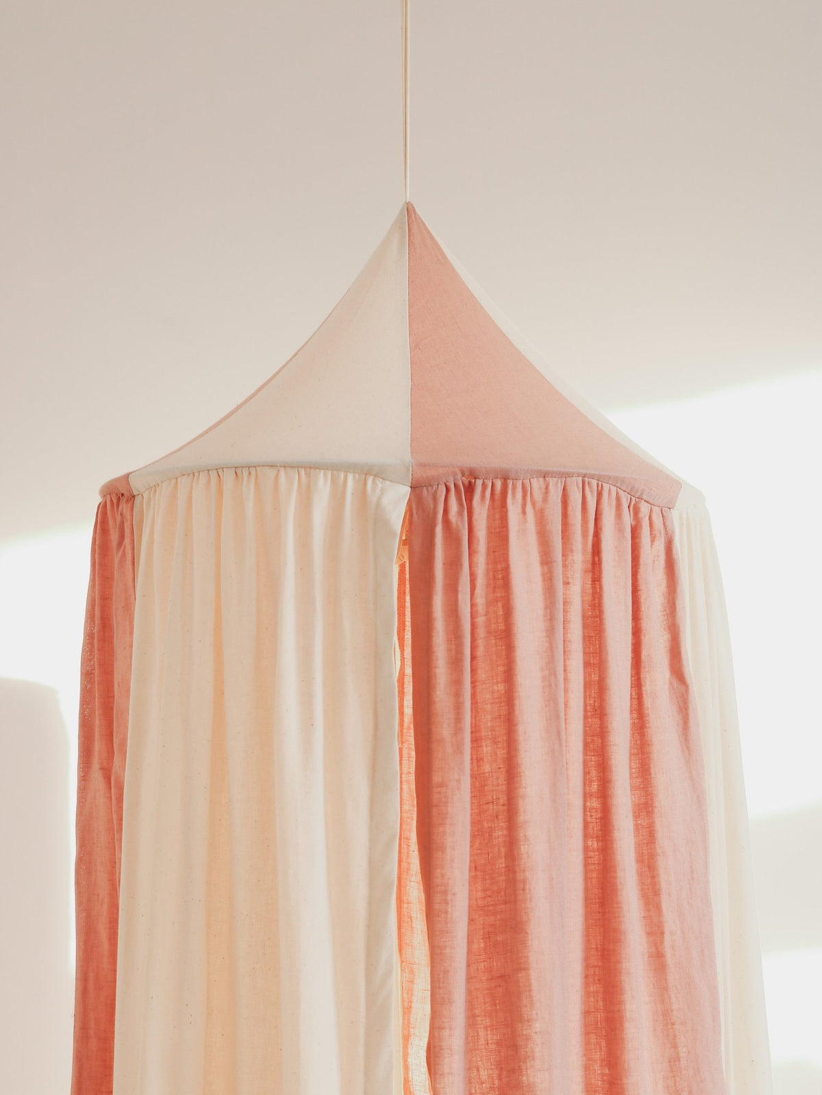 4. Close-up of powder pink and cream canopy top, highlighting the fabric texture and color contrast.