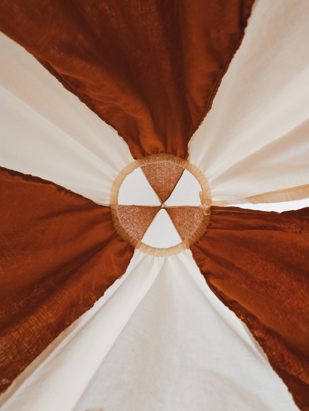 9. Close-up of caramel and cream canopy fabric showing circular pattern