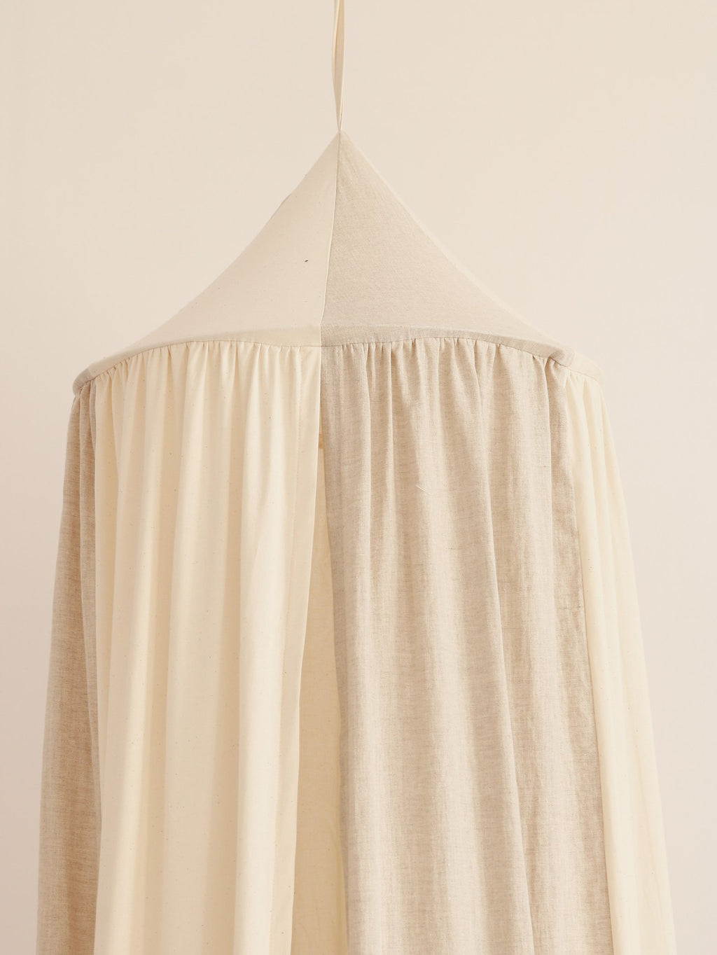 8. Close-up of cream canopy top with gathered fabric