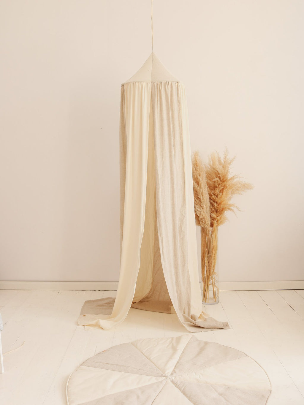 6. Cream canopy with pampas grass in a minimalist room