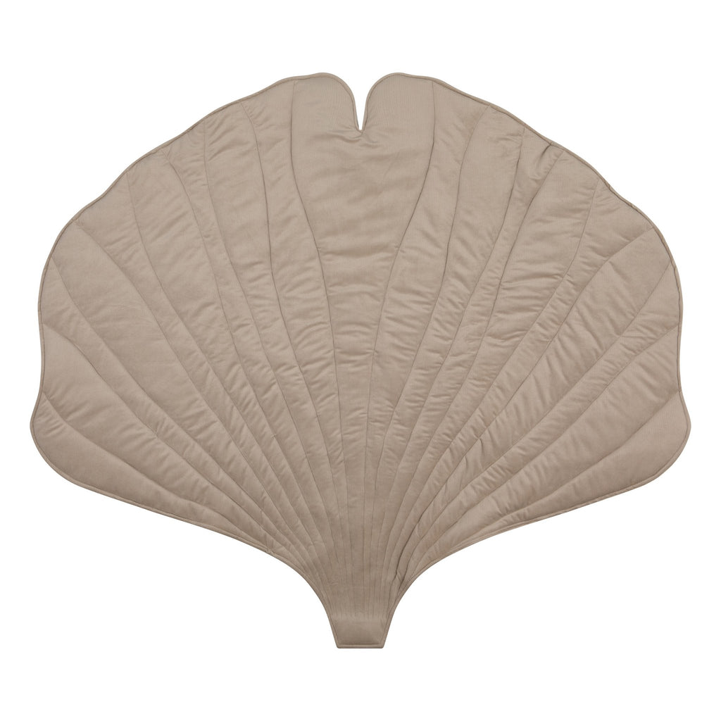 2. Studio shot of cream ginkgo leaf playmat with quilted texture, highlighting its organic cotton and velvet material