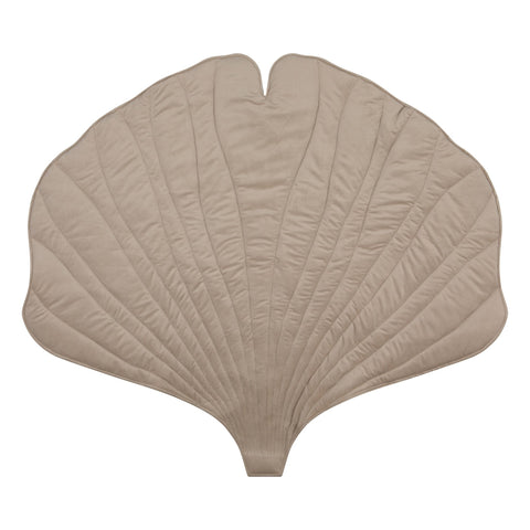 2. Studio shot of cream ginkgo leaf playmat with quilted texture, highlighting its organic cotton and velvet material