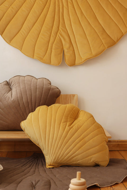 5. Close-up of yellow ginkgo leaf playmat with matching cushions in a cozy setting