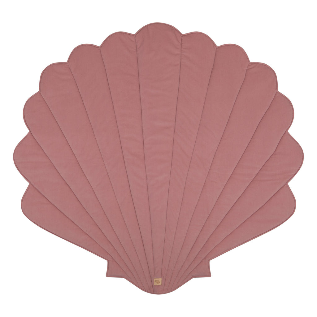 8. Studio shot of powder pink shell-shaped playmat on white background
