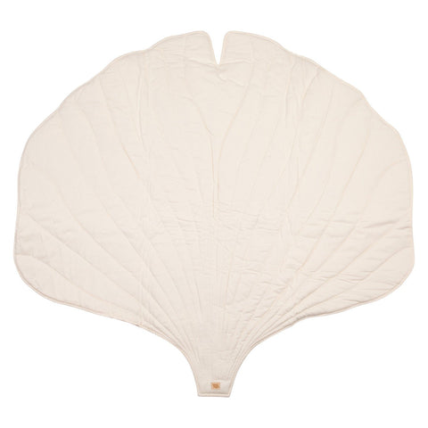 2. Cream-colored ginkgo leaf-shaped playmat made from organic cotton and linen on a white background
