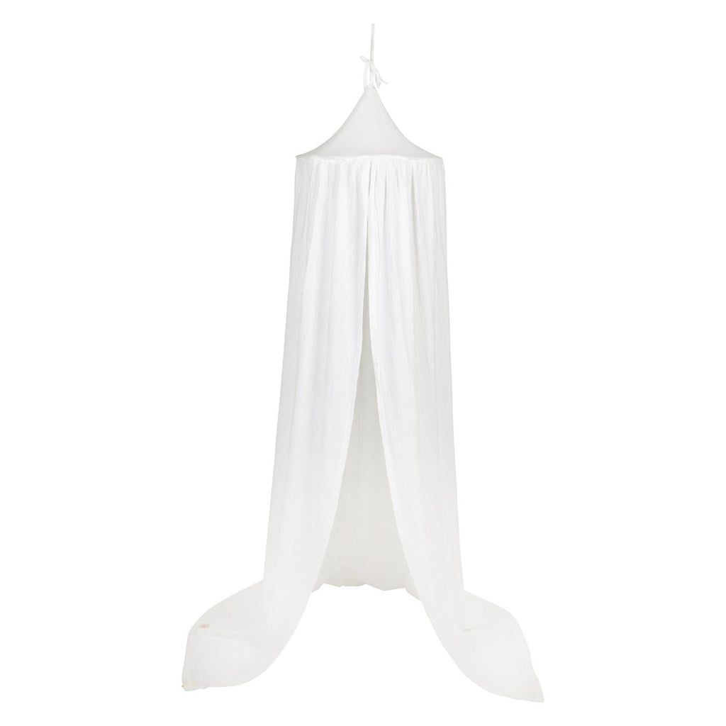 2. Studio shot of cream cotton canopy with flowing drapes, highlighting its elegant design