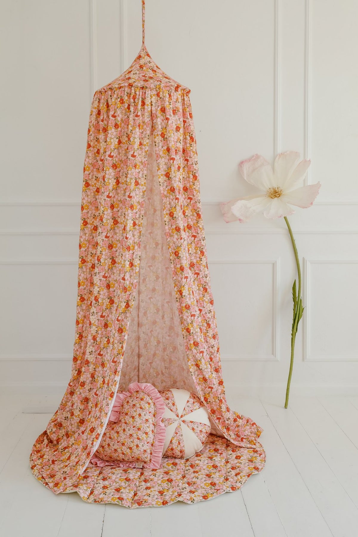 18. Floral canopy with cushions and flower decor in a bright room