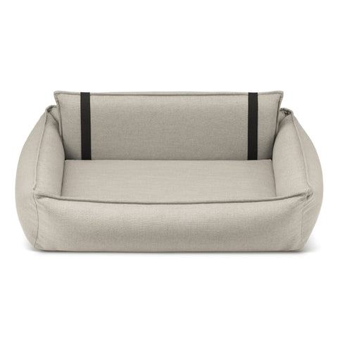 2. Beige Orteo dog bed by Labbvenn with orthopedic features, shown in studio setting highlighting removable rear backrest and elastic elements for enhanced comfort and support