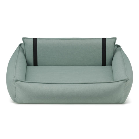 2. Orteo dog bed in soft teal with orthopedic features, showing removable backrest and elastic elements, made from hypoallergenic materials by Labbvenn, studio shot highlighting design and comfort.