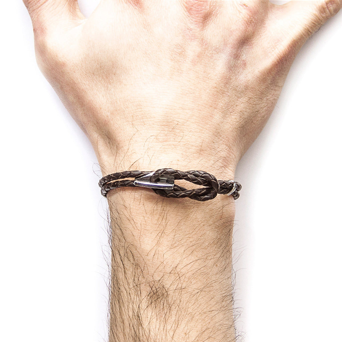 2. Men's Padstow silver and dark brown braided leather bracelet by ANCHOR & CREW, worn on wrist, studio shot