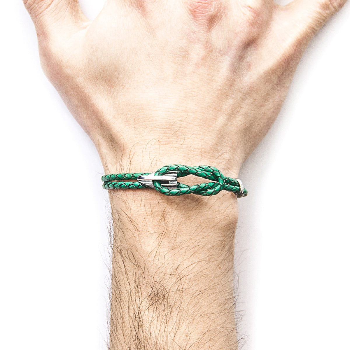 2. Close-up of men's Padstow Silver and Braided Leather Bracelet in Fern Green on wrist, highlighting clasp detail