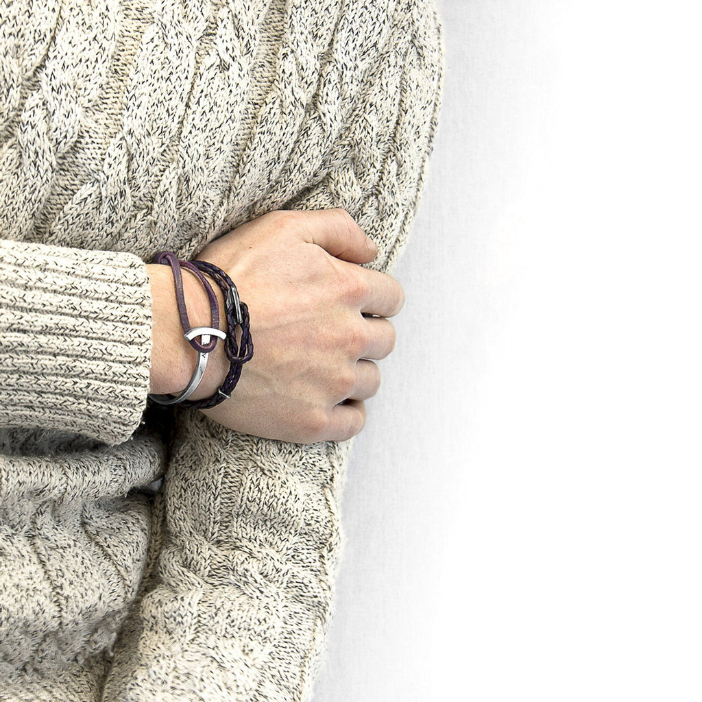 1. Men's Padstow silver and braided leather bracelet in grape purple by ANCHOR & CREW, styled with a cozy sweater