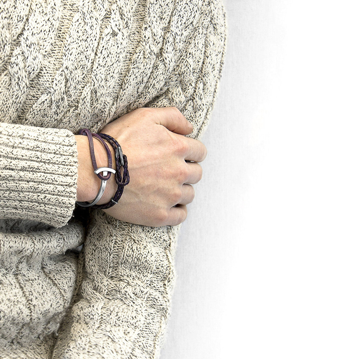 1. Men's Padstow silver and braided leather bracelet in grape purple by ANCHOR & CREW, styled with a cozy sweater