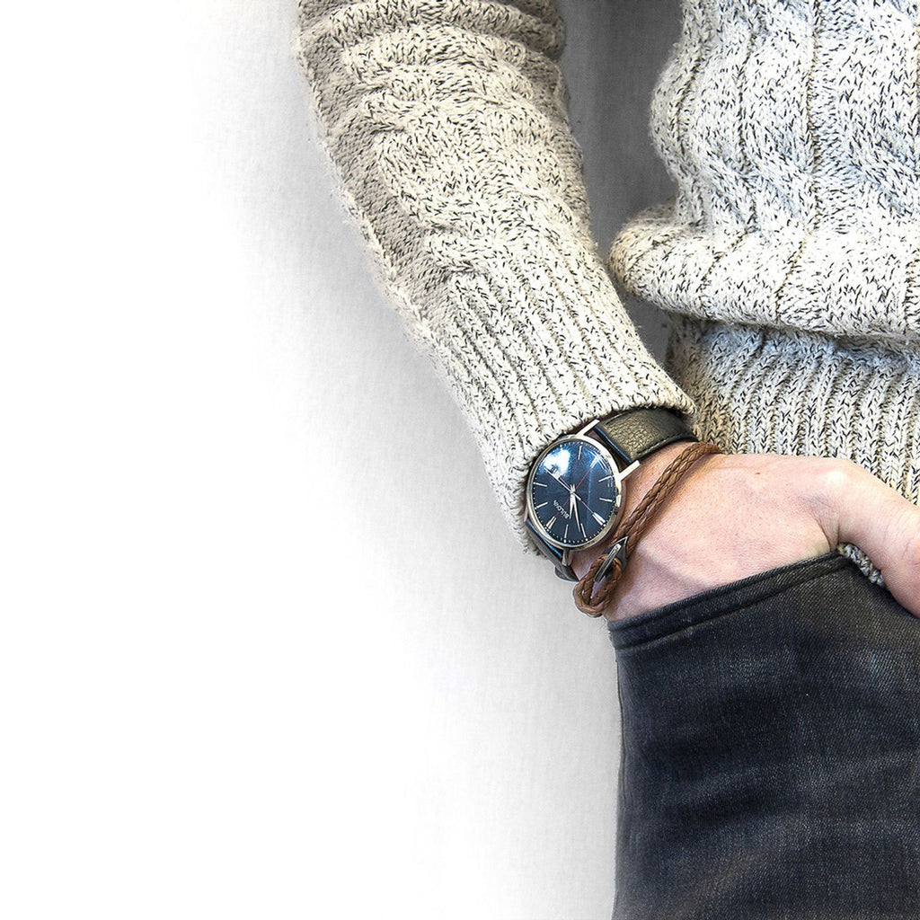 1. Men's Padstow silver and braided leather bracelet in light brown worn with a watch, styled with a sweater and jeans