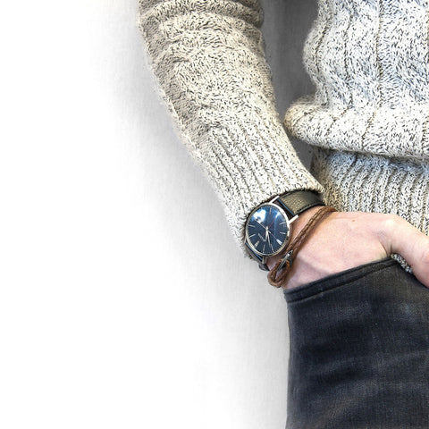 1. Men's Padstow silver and braided leather bracelet in light brown worn with a watch, styled with a sweater and jeans