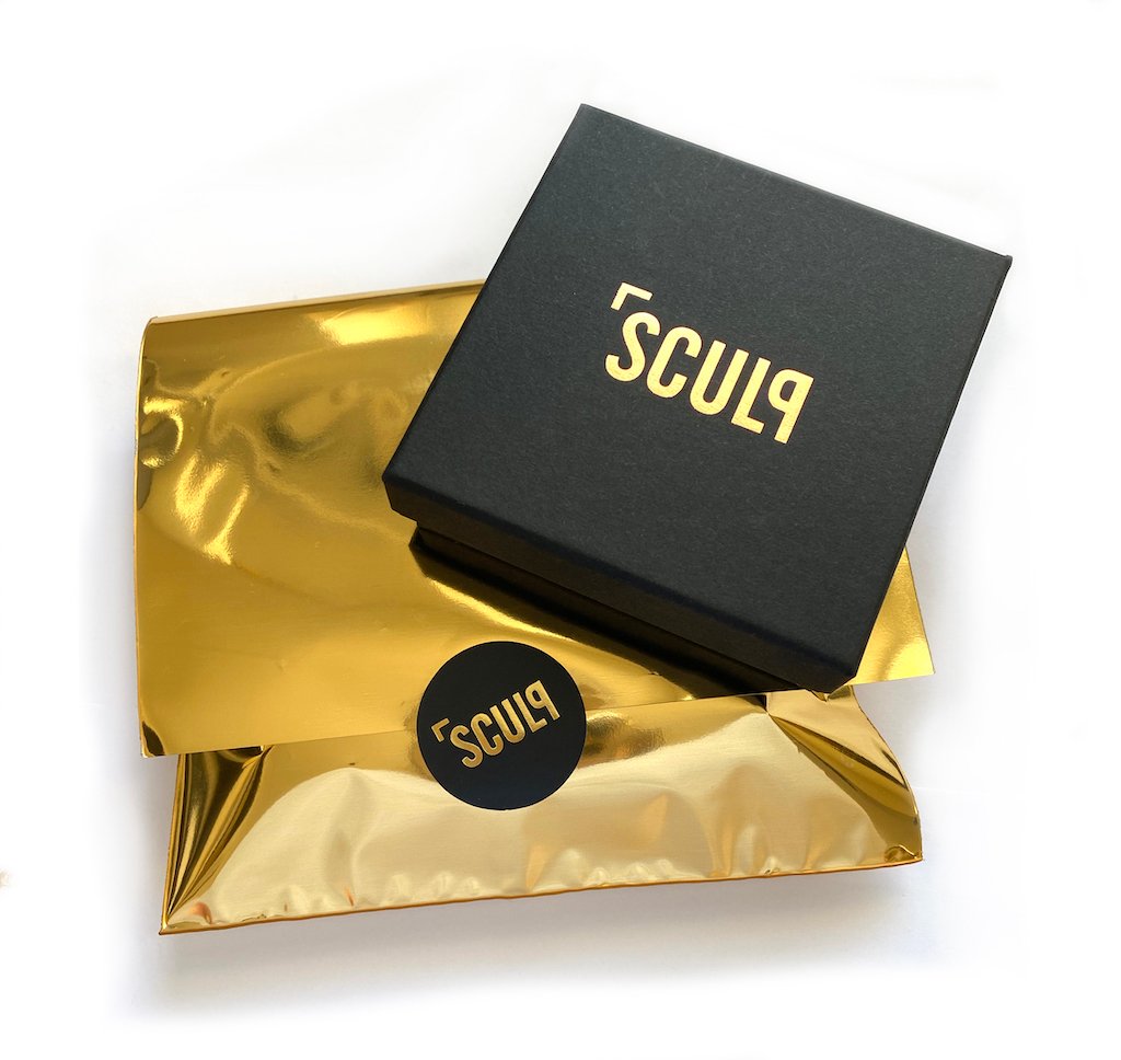 4. SCULP branded black gift box with gold packaging for All You Need Is Love necklace