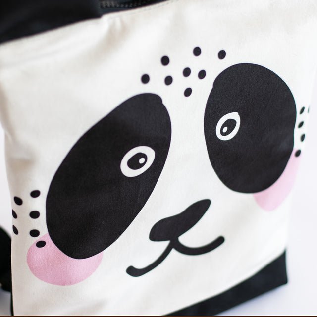 9. Close-up of Muni Panda backpack face design, highlighting velvet fabric details