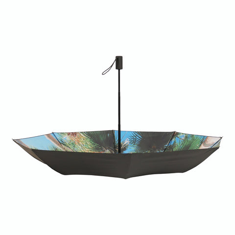 2. Studio shot of open Paradise Umbrella with tropical print and black exterior, highlighting windproof structure